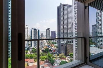 View from the balcony of a high-rise apartment overlooking the city