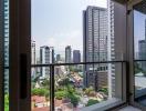 View from the balcony of a high-rise apartment overlooking the city