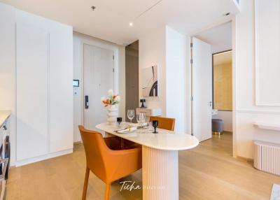 Modern dining area with open layout connecting to the kitchen and entryway