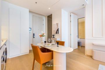 Modern dining area with open layout connecting to the kitchen and entryway