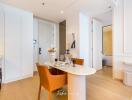 Modern dining area with open layout connecting to the kitchen and entryway