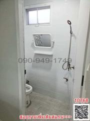 Compact bathroom with white fixtures and natural light