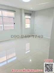 Bright empty room with glossy tiled floor and multiple windows