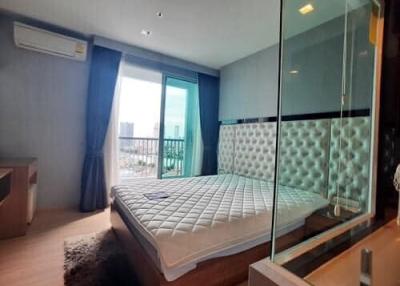 Modern bedroom with glass partition and balcony access