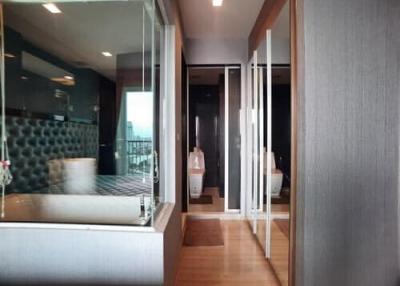 Modern bedroom with en-suite bathroom and balcony access