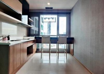 Modern kitchen with dining area and ample natural light