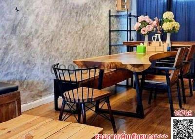 Cozy dining room with wooden furniture and stylish decor