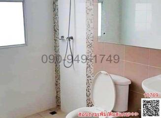 Modern bathroom interior with a toilet and shower