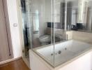 Modern bathroom with glass shower and jacuzzi