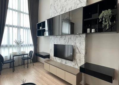 Modern living room with marble wall and entertainment unit