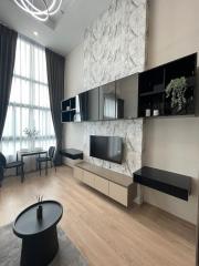 Modern living room with marble wall and entertainment unit