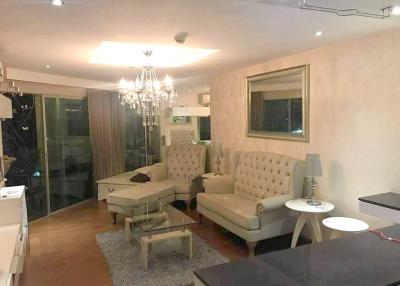 Elegant living room with modern furnishings and chandelier lighting