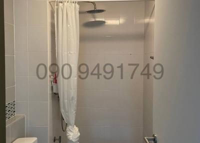 Modern bathroom with walk-in shower and white fixtures