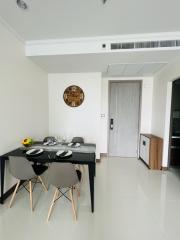 Modern dining room with elegant table setting and tiled flooring