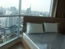 Modern bedroom with a view of the city skyline