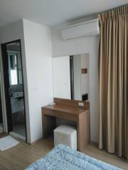 Compact modern bedroom with work desk and air conditioning