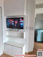 Modern Living Room Interior with Mounted Television and Shelving Units