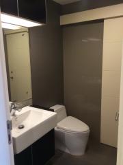 Modern bathroom with wall-mounted sink and toilet