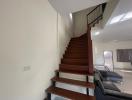 Modern living room with staircase and seating area