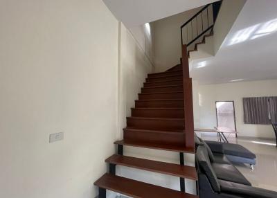 Modern living room with staircase and seating area