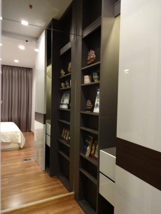 Modern bedroom with a built-in wardrobe and shelving unit