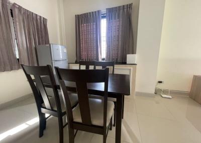 Compact dining area with table and chairs adjacent to the kitchen