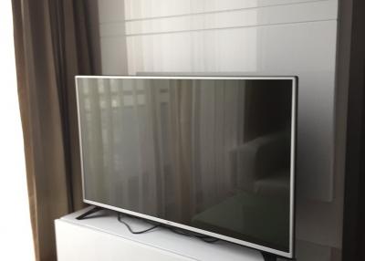 Modern television set mounted in a living room