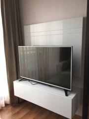 Modern television set mounted in a living room