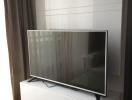 Modern television set mounted in a living room