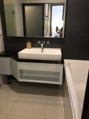 Modern bathroom with large mirror and vanity