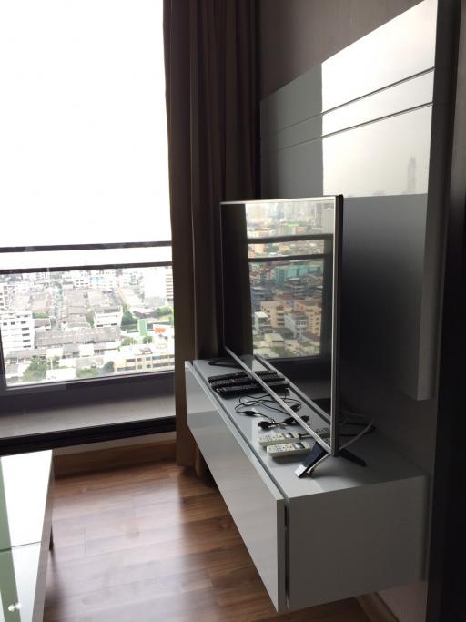 Modern living room interior with city view through a large window