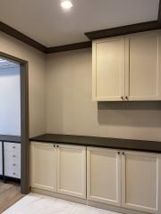 Modern kitchen with white cabinetry and ample storage