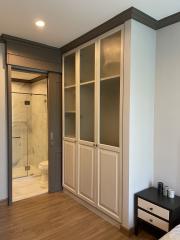 Modern bedroom with built-in wardrobe and attached bathroom