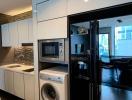 Modern kitchen with stainless steel appliances and stone backsplash