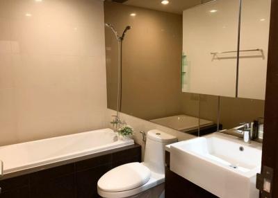 Modern bathroom with shower, bathtub, and vanity