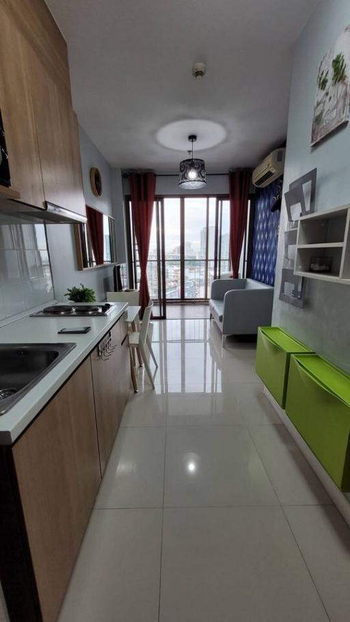 Contemporary kitchen with combined dining area leading to a living space