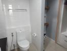 Modern bathroom with white tiles and elegant fixtures