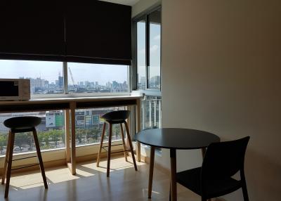 Modern living area with city view and natural lighting