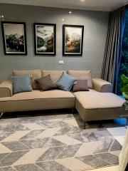 Cozy living room with sectional sofa and framed wall art