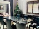 Elegant dining room with a Christmas tree and modern furnishings