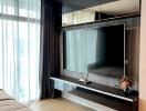 Modern bedroom interior with mounted television