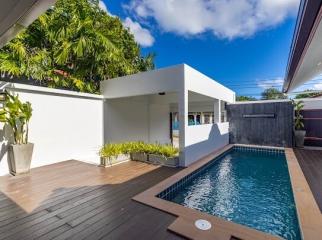 Modern home exterior with swimming pool and deck