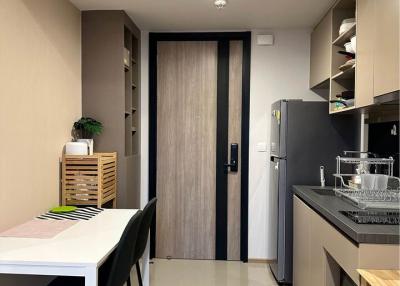 Modern kitchen with dining area and wooden finishes