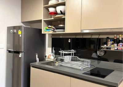 Modern kitchen with stainless steel appliances and wooden cabinets