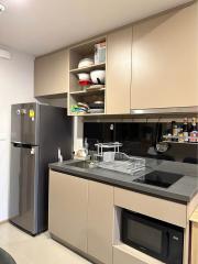 Modern kitchen with stainless steel appliances and wooden cabinets