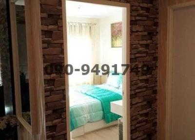 Cozy bedroom interior with stone wall decoration