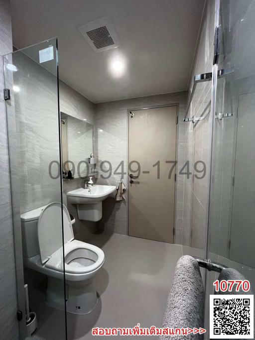 Modern bathroom interior with glass shower and tiled walls