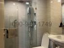 Modern bathroom with glass shower enclosure and mounted water heater