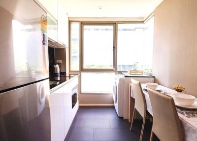 Modern kitchen with dining area and large windows