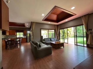 Spacious Living Room with Open Kitchen and Dining Area